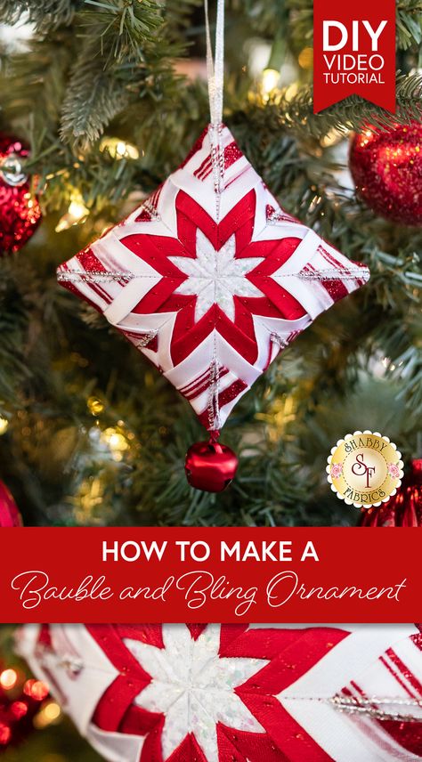 Jen and Bethany invite you to join in the spirit of gift-giving as they share how to make a beautiful Bauble & Bling Folded Ribbon Ornament! Your stunning stash of woven ribbon comes in handy for this joyful craft project. Layered and folded, the ribbon comes alive in the shape of a sparkly star. Add a charm or a string of beads to the bottom to give your bauble some bling! Check out all the links below for everything you need to make this perfectly giftable project! Folded Fabric Ornaments Free Pattern, Sewn Christmas Ornaments, Sew Christmas, Ribbon Ornaments, Christmas Sewing Projects, Free Pattern Download, Folded Fabric Ornaments, Folded Fabric, Woven Ribbon