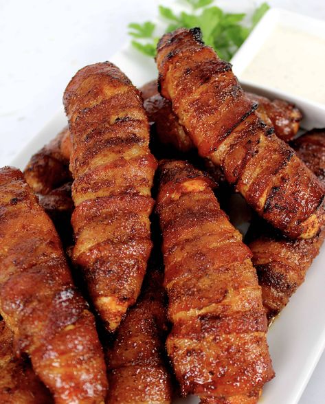 Bacon Wrapped Air fryer Chicken Tenders Air Fryer Bacon Wrapped Chicken Tenders with just 4 ingredients, have the most amazing combination of smokey, sweet and spicy flavors! They are perfect for game day and party appetizers. #ketoairfryerchicken #ketoairfryerrecipes #airfryerchicken Air Fryer Bacon Wrapped Chicken, Air Fryer Bacon, Bacon Wrapped Chicken Tenders, Actifry Recipes, Air Fryer Chicken Tenders, Bbq Bacon, Wrapped Chicken, Air Fry Recipes, Bacon Wrapped Chicken