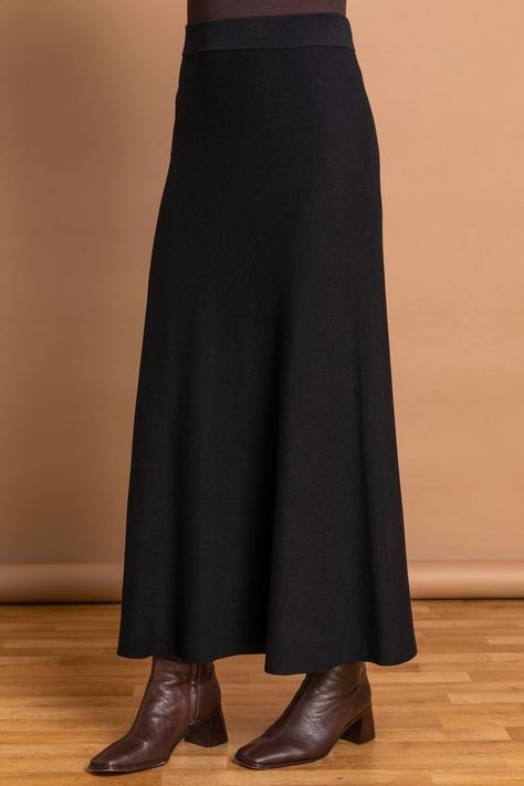 Keep it classic with this elegant knitted midi skirt. It's A-line shape and elasticated waistband ensures that it's comfortable for everyday wear, whilst it's midi length gives you a flattering modest chic look. Complete your ensemble with boots a classy top for a look that takes you from desk to dinner with minimum effort and maximum style. Hand wash only. 70% Viscose, 30% Nylon. Knitted Maxi Skirt, Modest Chic, Knitted Midi Skirt, A Line Midi Skirt, Knitted Skirt, Knit Maxi Skirt, Black Plain, Knit Midi Skirt, Stretch Skirt