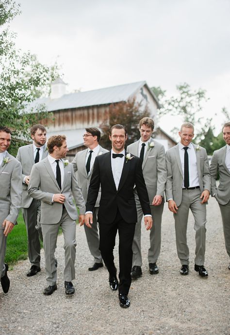 The groom looks dapper in his black tux and bow tie with the groomsmen in light gray suits with black ties ~ we ❤ this! moncheribridals.com Suits And Ties, Gray Groomsmen Suits, Groomsmen Outfit, Groomsmen Poses, Wedding Groomsmen Attire, Groom And Groomsmen Suits, Groomsmen Grey, Groomsmen Outfits, Happy Model