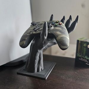 Materials: PLA, Plastic, Biodegradable Plastic  Printed In Black Demon Hand Controller Stand Holder Gaming 3D Printed Fantasy Holder Gaming Accessories Twitch Streaming Office Decor Playstation Xbox Controller Stand 3d Print, Xbox Controller Holder, Streaming Office, Black Demon, Controller Holder, Controller Stand, Twitch Streaming, 3d Ideas, Xbox Controller