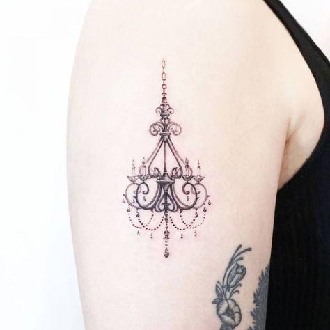 Chandelier tattoos have become more popular among women. Chandelier tattoos are one of the most elaborate and detailed tattoo designs out there. Chandelier Tattoo, Cool Wrist Tattoos, Single Needle Tattoo, Hand Tats, Detailed Tattoo, Wrist Tattoos For Women, Sternum Tattoo, Arm Chandelier, Skin Art