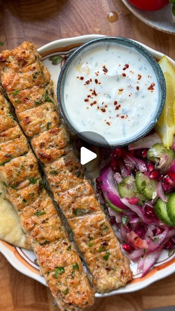 Iram Mansoor on Instagram: "Sheet Pan Chicken Kebab with Onion, Tomato, Cucumber Pomegranate Salad and Garlic Yogurt Sauce

Minced Chicken Kebab:

Ingredients:

- 2 lbs boneless, skinless chicken thighs, minced
- 1 large red onion, finely chopped and squeezed
- 1-2 jalapeños, finely chopped
- 8-9 cloves fresh garlic, minced
- 1 tbsp freshly minced parsley
- 2 tbsp tomato paste
- Salt, to taste
- 1 tsp black pepper
- 1 tbsp garlic powder
- 1 tbsp onion powder
- 1 tsp ground cumin
- 1 tsp red chili flakes
- 3 tbsp oil

For the Onion, Tomato, Pomegranate Salad:

Ingredients:

- 1 cucumber, sliced
- 1 red onion, sliced
- 1 large tomato, seeded and finely chopped
- 1/2 cup pomegranate seeds
- 1 tbsp freshly chopped parsley
- Salt, to taste
- 1 tsp sumac
- 1 tsp lemon juice
- 2 tbsp olive oil

F Chicken Kebab Sheet Pan, Chicken Kabob Sheet Pan, Sheet Pan Chicken Kebab, Sheet Pan Kabobs, Sheet Pan Chicken Kabobs, Ground Chicken Kabobs, Greek Sheet Pan Chicken, Sheet Pan Greek Chicken, Middle Eastern Recipes Arabic Food