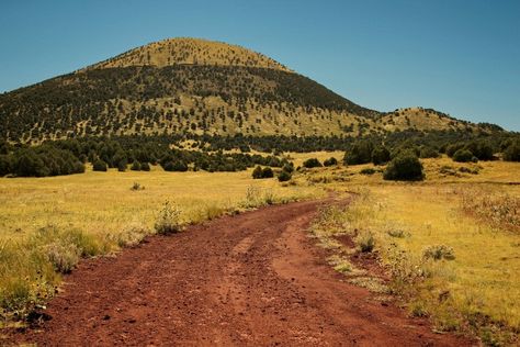 New Mexico's Capulin Volcano erupted about 60,000 years ago. However, Capulin is a part of the Raton-Clayton Volcanic Field, which spans roughly 8,000 square miles in northeastern New Mexico. This volcanic field began erupting about 9 million years ago, possibly drawing molten magma from a single source to create numerous cinder cones and volcanic domes, along with one enormous andesite-shield volcano known as Sierra Grande. Cinder Cone Volcano, Shield Volcano, Lava Tubes, Mount Shasta, Crater Lake National Park, Lava Flow, Active Volcano, Big Island Hawaii, National Monuments