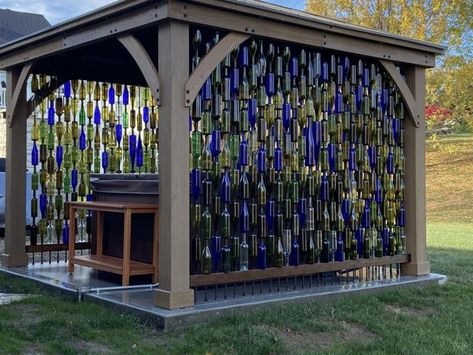 Walls made of wine bottles in O'Fallon, Mo., and 6 other great ideas for reuse | Home & Garden | stltoday.com Upcycle Material, Wine Bottle Fence, Bottle Fence, Wine Bottle Trees, Wine Bottle Garden, Wine Bottle Wall, Hot Tub Gazebo, Bottle Trees, Bottle Tree