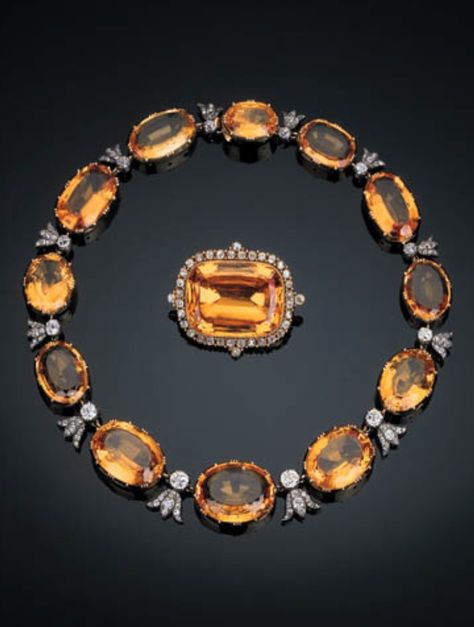 A rare antique topaz and diamond demi-parure, circa 1860. The articulated necklace comprising twelve graduated oval-shaped topaz with old-cut diamond collet and diamond-set trefoil connections, the brooch set with a rectangular cushion-cut topaz within an old-cut diamond surround, mounted in silver and gold. Imperial Topaz, Vintage Fine Jewelry, Topaz Jewelry, Victorian Jewelry, Vintage Jewels, Van Cleef, Gems Jewelry, Gorgeous Jewelry, Dream Jewelry