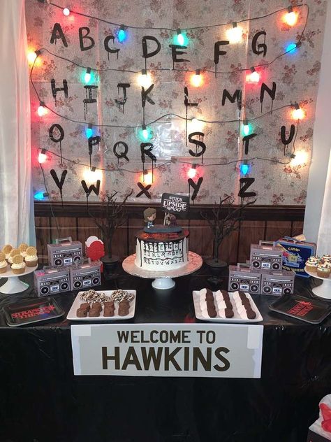 Take a look at this awesome Stranger Things Birthday! The dessert table is so cool!  See more party ideas and share yours at CatchMyParty.com #catchmyparty #partyideas #strangersthings #halloweenparty #strangersthingsdesserttable Stanger Thing Birthday, Stranger Things Birthday Party Ideas Decoration, Stranger Things Theme Party Decorations, Stranger Things Table Decor, Stranger Things Birthday Theme, Stranger Things Centerpiece Ideas, Halloween Decorations Stranger Things, Halloween Stranger Things Decorations, Stranger Things Backdrop