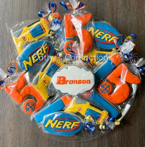 Nerf Cookies Decorated, Nerf Cookies, Nerf Cake Ideas, Nerf Party Decorations, Nerf Party Food, Nerf Birthday Cake, Nerf Party Ideas, Nerf Birthday Party Ideas, Nerf Cake