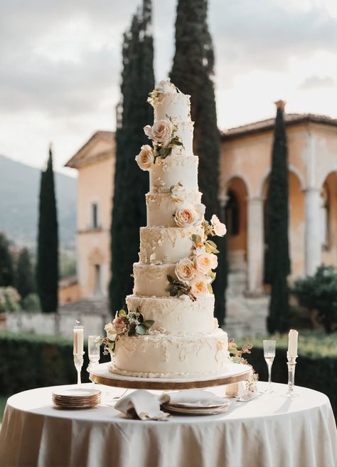 Elegant Wedding Cake Perfection: A Fine Art Dream in Coastal Italy  Prepare to be mesmerized by this exquisite tall wedding cake, captured in the soft light of a classic Italian villa. Its delicate tiers, adorned with intricate designs, evoke a timeless elegance. 👰🤵🏼‍♂️💍 #WeddingCake #FineArt #ItalianVilla #CoastalCharm #WeddingInspiration Classic Wedding Cakes Elegant, Classic Elegant Wedding Cake, Vintage Wedding Cakes Elegant, French Wedding Cake, Tall Wedding Cake, French Wedding Cakes, Coastal Italy, Tall Wedding Cakes, Italian Wedding Cakes