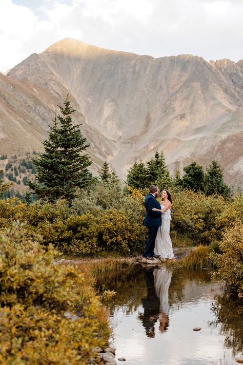 Bride and groom embrace one another surrounded by large mountain views and their reflection is visible in a little pond. Loveland Pass Engagement Photos, Elopement In Colorado, Loveland Pass Elopement, Loveland Pass Colorado, Colorado Elopement Photography, Denver Elopement, Ski Wedding, Colorado Mountain Elopement, Elopement Shoot