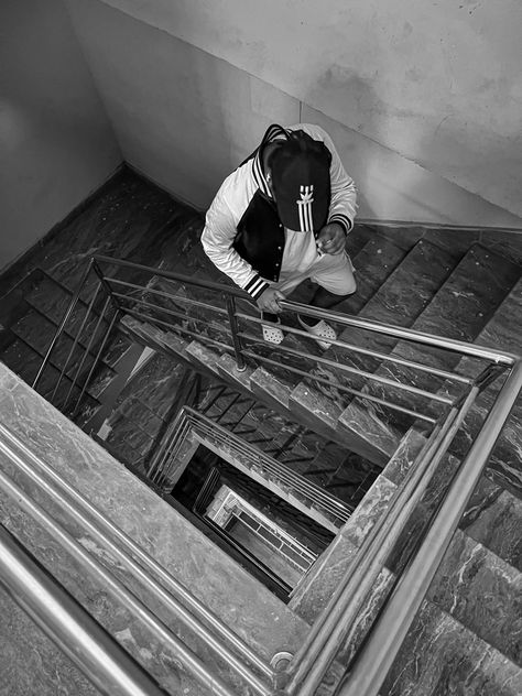 Black and white Aesthetic photography idea of a boy walking on stairs Walking On Stairs, Poses Walking, Stairs Aesthetic, Streetwear Poses Photo Ideas, Instagram Highlight Covers Icons, Walking Up The Stairs, Walking Up Stairs, Walking Poses, Boy Walking