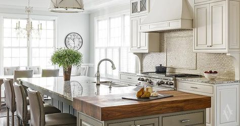 A gray kitchen island is topped with a white and grey granite countertop as well as an end piece ... Gray Kitchen Island, Painted Kitchen Island, Marble Backsplash Kitchen, Butcher Block Island Kitchen, Grey Kitchen Island, Island Countertops, Leather Counter Stools, Countertop Design, New Kitchen Cabinets