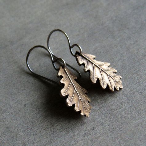 "These wonderful eye-catching nature inspired real oak leaf earrings are made of shiny golden bronze and sterling silver in petite size. So dainty! Adorable pieces of nature captured in silver. All metal components were made by me: earrings were crafted from bronze and sterling silver (earwires), uniquely textured, carved and polished to bring out the highlights. They were darkened darkened for a wonderful rustic look.  A tiny piece of art, gorgeous and lightweight! These pretty earrings offer a Oak Leaf Earrings, Ear Piercings Tragus, Visual Style, Real Leaf, Magical Jewelry, Bronze Jewelry, Botanical Jewelry, Oak Leaf, Funky Jewelry