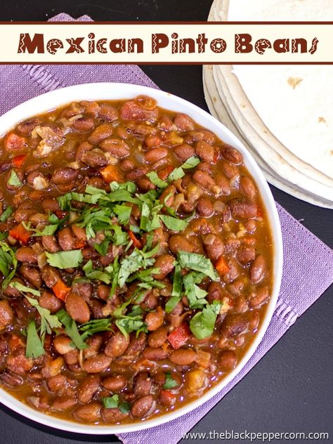 Mexican Pinto Beans - Frijoles Charros, mash to make refried - Mexican pinto beans with cumin, coriander, cinnamon onion and pepper. The brown sugar gives a hint of sweetness and the chipotle powder gives some smokey spice. Taco Beans Recipe, Mexican Beans Recipe, Enchiladas Sauce, Pinto Beans Recipe, Mexican Pinto Beans, Mexican Beans, Mexican Enchiladas, Chipotle Powder, Pinto Bean Recipes