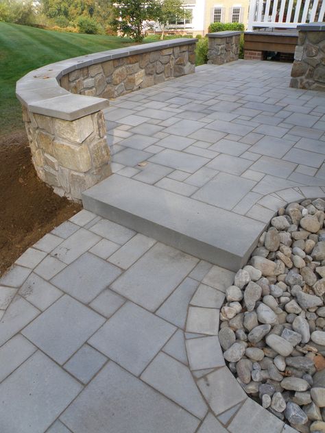 Stamped Concrete Patio Bluestone, Stone Wall Patio, Paver Patio With Retaining Wall, Patio Inspiration Backyard, Patio With Stone Wall, Paved Patio Garden Ideas, Outdoor Patio Stone, Landscaping Steps, Paver Stone Patio