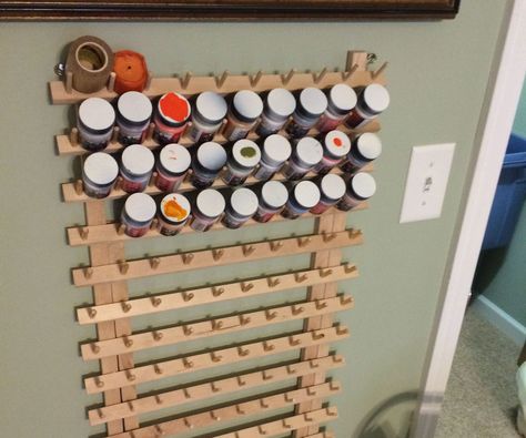 This is the basis for my storage rack, its a sewing thread rack I rescued from a thrift store. It fits both the apple barrel craft type paints and the shorter model round paints for painting model cars and things like that. The thread spools are meant to slip over the pegs, I slide paint bottles between the pegs. Toy Storage Wall Unit, Paint Storage Diy, Apple Barrel Paint, Paint Organizer, Shoe Storage Small Space, Thread Rack, Paint Rack, Paint Organization, Window Shelves