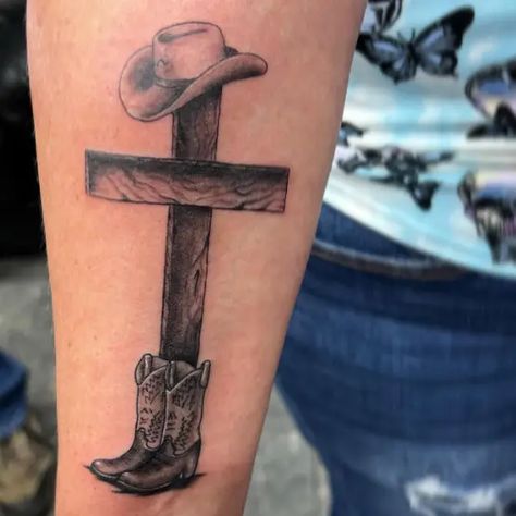 Electrik Needle Tattoo Country Forearm Tattoo Men, Cross With Cowboy Hat Tattoo, Cowboys And Angels Tattoo, Judas Ate Too Tattoo, Cross Tattoo On Ribs, High Noon Tattoo, Western Tattoos For Men, Cowboy Tattoos For Men, Brilliant Tattoo