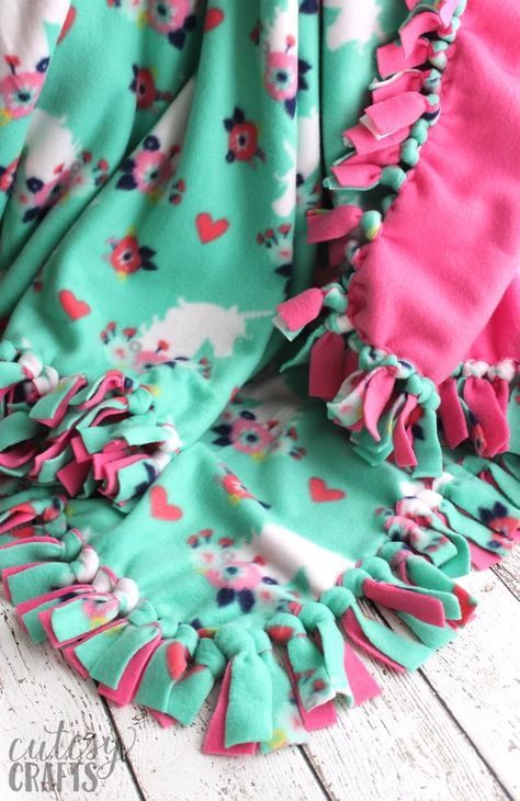 How to Make a Tie Blanket from Fleece - Cutesy Crafts Knotted Fleece Blanket, Diy Tied Fleece Blanket, Making A Fleece Tie Blanket, How To Make Fleece Tie Blankets No Sew, Fleece Tie Blankets Size, How To Tie Blanket, Tie Blanket Patterns, How To Make A Fleece Tie Blanket, Hand Tied Blanket