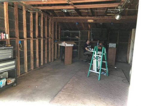 Our Garage Renovation • The April Blake Old Garage Renovation, Office Laundry Room, And So It Goes, Backyard Garage, Garage Door Styles, Attic Doors, Wood Plank Flooring, Garage Renovation, Carriage Doors