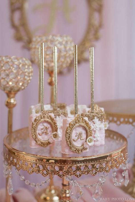 Arianas Royal Baptism | CatchMyParty.com Princess Party Cake Pops, Princess Theme Rice Crispy Treats, Rose Gold Treats Ideas, Quinceanera Treats Ideas, Princess Party Dessert Table, Rose Gold Candy Table Ideas, Princess Theme Dessert Table, Princess Theme Baby Shower Ideas, Cookies Decoration Ideas