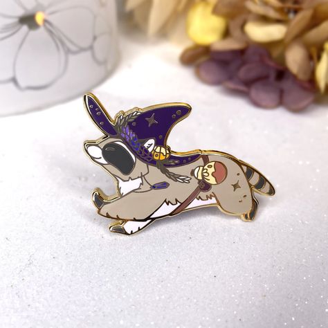 "THIS IS A PRE ORDER, PLEASE, BE AWARE OF PREPARATION TIME. Pin details: - Hard enamel pin, gold plating. - Size: 5cm, 2\" long - 2 rubber clutches. B-grades pins have minor mistakes barely noticeable. C-grades pins have more noticeable mistakes. The colors could be slightly different than the ones in the photos." Enamel Pin Collection, Halloween Autumn, Halloween Pins, Trash Panda, Magical Jewelry, Pin Art, Cool Pins, Pin Jewelry, Metal Pins