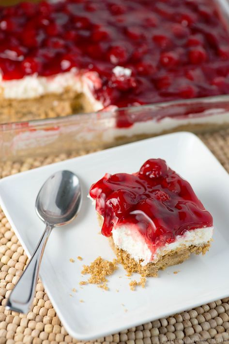 Cherry Delight - a yummy graham cracker crust with a middle layer of homemade whipped filling, all topped with a delicious layer of cherries! Cherry Delight Dessert, No Bake Cherry Cheesecake, Cherry Delight, Biscuits Graham, Cherry Desserts, Cherry Cheesecake, Cherry Recipes, Pudding Desserts, Cherry Pie Filling