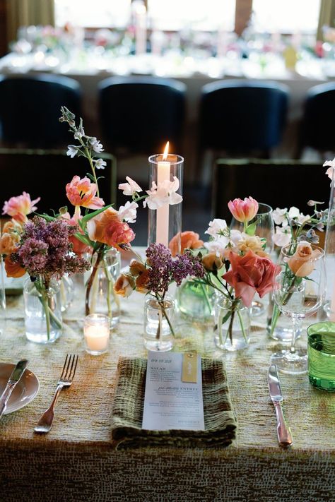 Flower Candle Table Decorations, Wild Flowers And Candles Wedding, Bud Flowers Wedding Table, Wildflower Candle Centerpiece, Spring Tablescapes Ideas French Country, Coloured Candles Wedding, Bus Vases Wedding, Budvase Tablescape Wedding, Wedding Table Candle Centerpieces