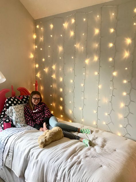 How to Easily Install Curtain Twinkle Lights Twinkle Lights Desk, Curtain Lights Bedroom Ideas Wall, Twinkle Lights Girls Bedroom, Curtain Lights Above Bed, How To Hang Curtain Lights On Wall, Curtain Lights Bedroom Wall, Curtain Fairy Lights Bedroom, Fairy Lights Behind Bed, Fairy Lights Above Bed