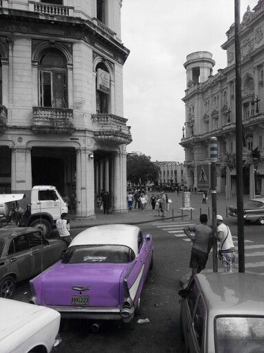 Purple car! Neat colorized photo, and the  black-and-white setting is Havana... Purple Black White Aesthetic, Black And White And Purple Aesthetic, Black And White Photos With Pop Of Color, Black And White With Pop Of Color Photography, Black White And Purple Aesthetic, Black And White Photo With Pop Of Color, Black And White With A Splash Of Color, Black And White With Pop Of Color, Color Splash Purple