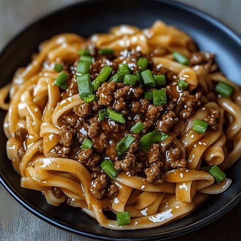 Mongolian Ground Beef Noodles offer a delightful blend of savory, sweet, and spicy flavors, all wrapped up in a quick and easy meal. This recipe combines the richness of ground ... Read more Ground Beef Thai Noodles, Ground Beef Recipes Noodles, Chinese Noodles With Ground Beef, Ground Turkey Recipes Asian, Ground Beef Chinese Food, Asian Style Ground Beef, Ground Turkey Ramen Noodle Recipes, Ground Beef Mongolian Noodles, Mongolian Beef Recipe Noodles