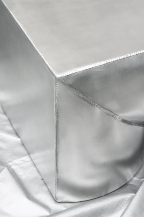 XS is a minimal aluminum series designed by Milan-based studio CARA \ DAVIDE. An ongoing research in aluminum as a material and it’s characteristics in production.⁠ The XS collection is composed of unique sides tables and benches in rolled aluminum sheets with oversized proportions. Special emphasis is given to the tig welding as it is characteristic to aluminum processing. The Tig, Welded Furniture, Aluminum Sheets, Aluminum Furniture, Tig Welding, Minimalist Furniture, Aluminum Table, Metal Sheet, Aluminium Sheet