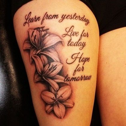 100 Popular Tattoo Designs and Meanings for Men & Women Thigh Tattoo Quotes, Wörter Tattoos, Lillies Tattoo, Lily Tattoo Design, Thigh Tattoo Designs, Snakebites, Live For Today, Inspiration Tattoos, Leg Tattoos Women