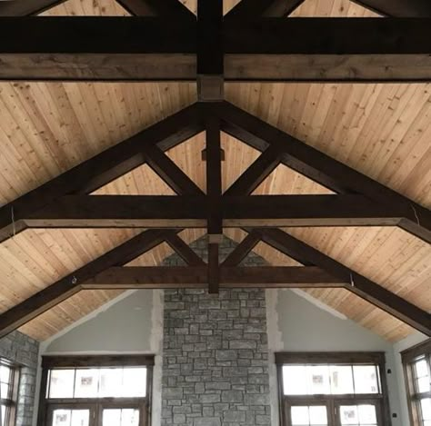 Truss ceiling in progress! That's a cedar ceiling and wrapped trusses that have been stained with Minwax 211 Provincial. Awesome! Black Trusses Ceilings, Interior Trusses Beams, Scissor Truss Ceiling Beams, Great Room With Trusses, 6/12 Vaulted Ceiling, Roof Truss Design Exposed Beams, Faux Trusses Vaulted Ceilings, Wood Truss Ceiling, Exposed Truss Ceiling