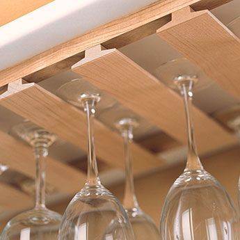 Watch this video to find out how to make an inexpensive rack to store and display wine glasses beneath the hanging cabinets in your kitchen, using standard T-molding available at home centers. Diy Wine Glass Rack, Beam Kitchen, Wine Glass Storage, Hanging Cabinet, Home Bar Designs, Wine Glass Rack, Hanging Rack, Rack Kitchen, Glass Rack