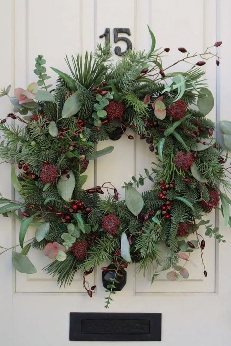 Explore the magic of the festive season with our selection of 17 Christmas wreaths, each a unique blend of traditional charm and contemporary elegance. Click to discover the perfect wreath to adorn your home, and follow us for more inspired Christmas decor ideas. Everlasting Wreaths, Christmas Flower Arrangements Ideas, Flower Garden Aesthetic, Fresh Wreaths, Winter Flower Arrangements, Faux Wreath, Winter Floral Arrangements, Ribbon Display, Fresh Wreath