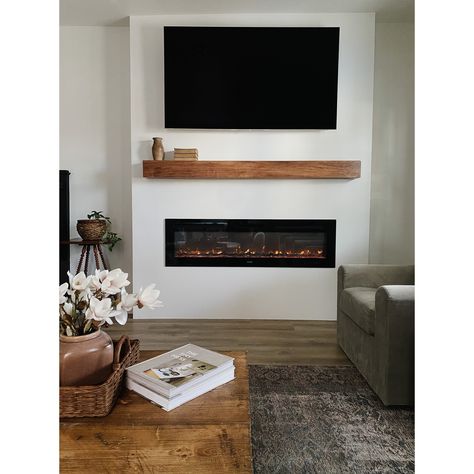 Add modern farmhouse style to your decor with this fireplace mantel shelf. Crafted from solid wood planks, the shelf is available in a variety of stylish finishes, accented with rustic detailing like knots and whorls for a more traditional design. Floating Shelf Above Fireplace, Modern Farmhouse Fireplace Mantel, Farmhouse Fireplace Mantel, Modern Farmhouse Fireplace, Wood Mantle Fireplace, Fake Fireplace, Fireplace Mantel Shelf, Floating Mantel, Wood Mantle