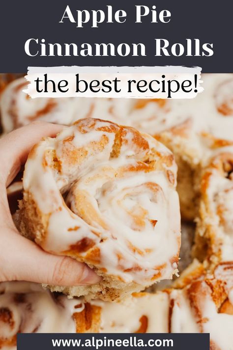 A hand grabbing a cinnamon roll covered in icing. Apple Sweet Rolls Recipe, Apple Pie Cinammon Rolls, Upside Down Apple Pie Cinnamon Rolls, Applesauce Cinnamon Rolls, Caramel Apple Cinnamon Rolls Homemade, Apple Cider Cinnamon Rolls, Apple Rolls Recipe, Apple Cinnamon Rolls Homemade, Apples And Cinnamon Rolls