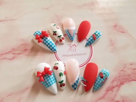 Blue and white gingham cherry nails with red matte accents. Choose your shape/length. Custom sizes should be left in the personalization section.  Each set will come with 12 nails, so there are 2 replacement nails just in case you lose one or two. Each set is handmade to order. Because of this, there will be differences in each set. Lighting or different monitors may change the look of color in the photos slightly. *All sets come in a gift box with an alcohol prep pad, cuticle stick, buffer, nail file, and glue. -Once shipped, I am not responsible for lost, delayed, or damaged packages. -I will not be held responsible for wrong sizes. If you are unsure of your sizes, you can purchase a sizing kit in the shape of your choice for a perfect fit. I will always do my best to ensure the sizes ar Red And Blue Cherry Nails, Red Gingham Nails, Picnic Nail Art, Red Blue Nails, Gingham Nails, Nails With Red, Set Lighting, Future Nails, Red And White Nails