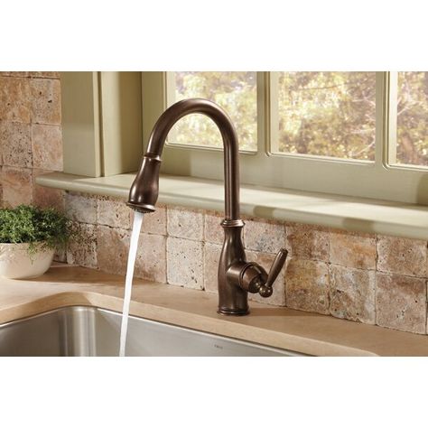 Enhance the look and functionality of your kitchen sink with this product. The faucet has one handle with a high arc pull-down spout, which makes the cleaning chores easier. It has an aerated stream with a pause function that lets you have a powerful rinsing experience. Oil Rubbed Bronze Kitchen Faucet, Kitchen Faucet Repair, Oil Rubbed Bronze Kitchen, Bronze Kitchen Faucet, Rubbed Bronze Kitchen, Moen Kitchen Faucet, Best Kitchen Faucets, Kitchen Faucet With Sprayer, Bronze Kitchen