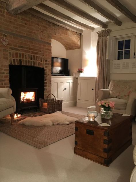 Hygge Tv Room, Cosy Farmhouse Exterior, French Gite Interior, Red Brick Chimney Living Room, Red Brick House Interior Living Rooms, Cosy Den Ideas, Cosy Basement Ideas, Red Brick Fireplace Decor Ideas, Brick Chimney Living Room