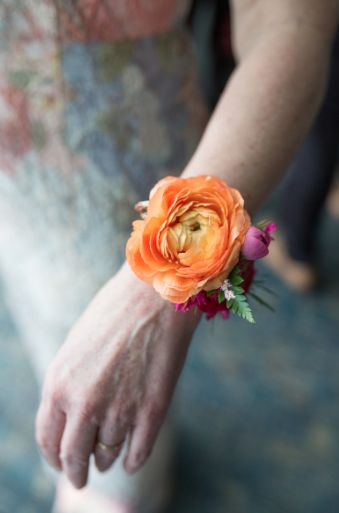 Bright Wrist Corsage, Pink Orange Boutonniere, Bright Corsage, Bright Boutonniere, Colorful Corsage, Corsage Diy, Boys Dressing, Ranunculus Arrangement, Prom Corsage And Boutonniere