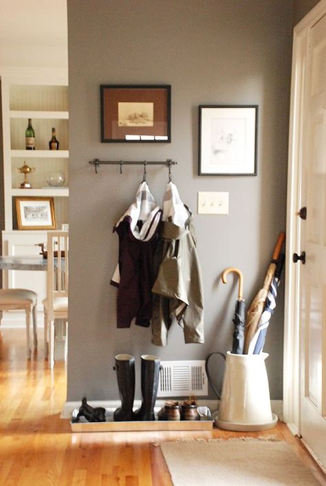 Piles near your doorway are just a fact of life. Don't underestimate the power of a cute umbrella holder and shoe tray to make everything feel tidier and fancier. See more at The Curtis Casa »  - GoodHousekeeping.com Vstupná Hala, Small Entryway, Decoration Inspiration, Style At Home, Home Fashion, Apartment Living, Small Apartments, Entryway Decor, Coat Rack