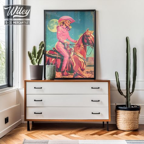 Elevate your space with our southwest-inspired "pink retro cowgirl riding horse" art print - a bold and vintage style addition to your southwest or western decor! This versatile piece is perfect for the western living room, bedroom, kids room, or little girls room, seamlessly complementing a ranch home, farmhouse, cabin, lodge, dorm room, apartment, or eclectic gallery wall. It also makes for an ideal housewarming gift for those embracing a hint of the southwest in their home or commercial space Large Western Painting, Western Pink Bedroom, Retro Cowgirl Bedroom, Mid Century Western Decor, Vintage Cowgirl Bedroom, Eclectic Western Decor, Disco Cowgirl Bedroom, Pink Western Room, Western Girls Room