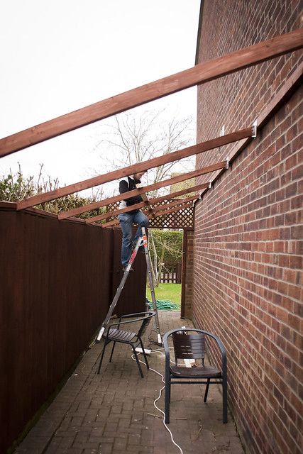 Side passage support beams going on | My husband attaching s… | Flickr Outside Storage Shed, Side Yard Landscaping, Side Yards, Support Beams, House Extension Design, Backyard Sheds, House Siding, Lego Worlds, Outdoor Gardens Design