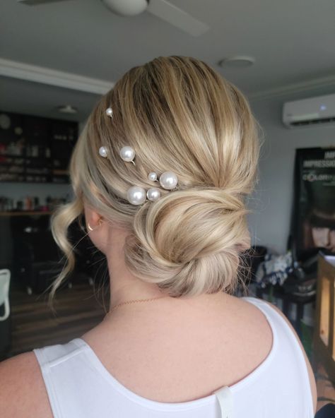 Soft, clean texture + pearl pins . Do we still love pearls? I have several sets in stock for this wedding season to rent or purchase. Please view the poll at the bottom of this post . @oneshothairawards @behindthechair_com #btconeshot2024_specialeventstyling . #novascotiawedding #novascotiaweddinghair #novascotiabridalhair . Accessories for the bride are discussed during trial and prior to the wedding but... Should I bring accessories on site in my kit for bridesmaids to purchase on spot? Short Wedding Hair With Pearls, Low Messy Bun Wedding Hair With Pearls, Bridal Hair With Pearl Pins, Bridal Updo Pearls, Bridesmaid Hair With Pearls, Wedding Hair With Pearls, Wedding Hair Pearls, Wedding Hair Pearl, Messy Bun Wedding