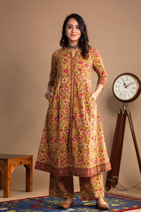 This A-line fit serene mustard kurta with two side pocket made of pure cotton fabric gives you comfort and space for movement. With border details and sequence work compliments the kurta appearance. It comes with a same print pant with two side pockets. Pant’s waist has half elastic at the back and tie thread at the front for comfortable fitting adjustments, pair this with our silver jewellery for the complete look. Same Print Kurta And Pants Pakistani, All Over Frock Design, Floral Kurta Sets For Women, Pocket Frock Designs, Pocket Dress Design Pakistani, New Kurti Designs Pakistani, Pant Pocket Stitching, Same Print Kurta And Pants, Printed Frock Suit With Plazo