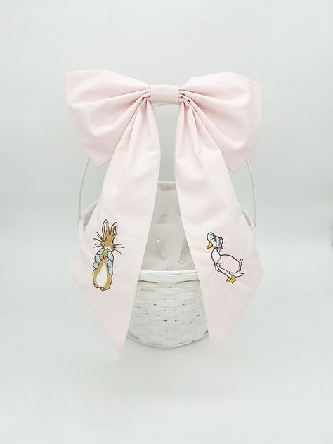 Large bow that can be hung on a wall or put on a Easter basket. This bow you can either hot glue to the basket or add some velcro to make it stick.  Measurements: 12x18 inches approx. Peter Rabbit Easter Basket, Pink Peter Rabbit, Peter Rabbit Easter, Embroidered Easter Basket, Duck Or Rabbit, Easter Vibes, Monogram Bow, Southern Baby, Pink Hair Bows