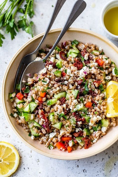 This farro salad is made with Mediterranean ingredients – cucumbers, tomatoes, lemon juice, feta, and mint – delicious as a side dish or even for lunch! #salad #healthyrecipe #healthyrecipes #weightwatcherrecipes #lowcalorierecipes #saladrecipes #farrorecipes #farrosalad Mediterranean Ingredients, Farro Recipes, Salad With Mint, Feta Salad Recipe, Lunch Salad, Salad With Feta, Salad Salad, Savory Salads, Farro Salad