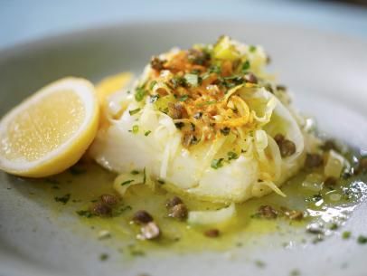 Caper-Herb Butter with Chilean Sea Bass Recipe | Geoffrey Zakarian | Food Network Caper-herb Butter With Chilean Sea Bass Food Network, Chermoula Chicken, Chilean Sea Bass Recipe, Seafood Cuisine, Sea Bass Recipe, Bass Recipe, Katie Lee Biegel, Sea Bass Recipes, Cannoli Dip