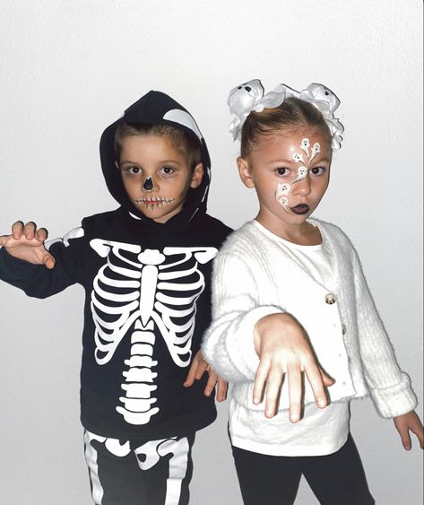 DIY skeleton and ghost costume. Space buns are made with tissue. Ghost Space Buns, Ghost Buns, Astronaut Sibling Costume, Toddler Ghost Costume Boy, Ghost Infant Costume, Toddler Girl Skeleton Costume, Toddler Girl Skeleton Costume Diy, Ghost Costume, Skeleton Costume